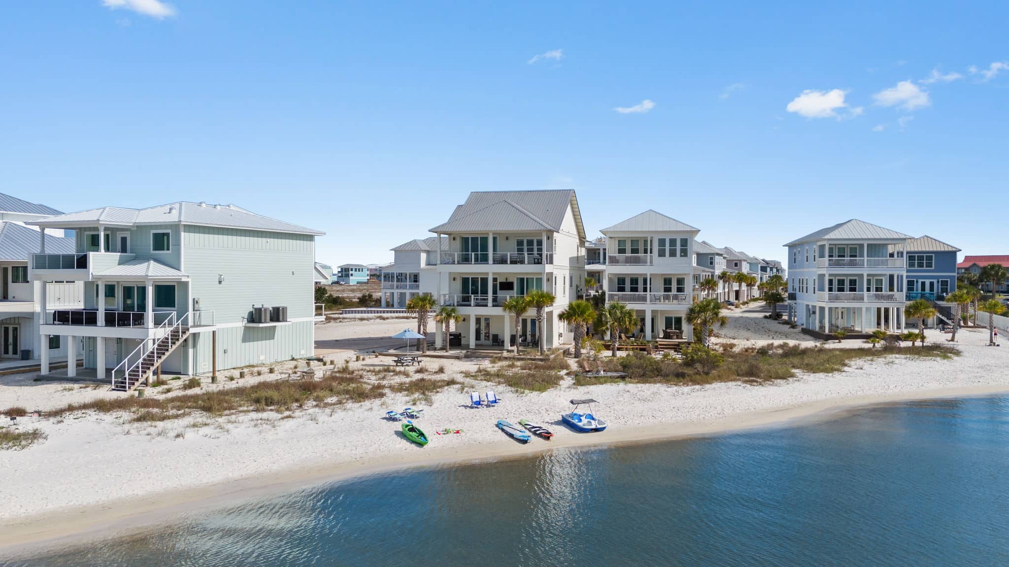 Aerial view of the calm sound-side shoreline and beach at Stella Maris on Navarre Beach, Florida